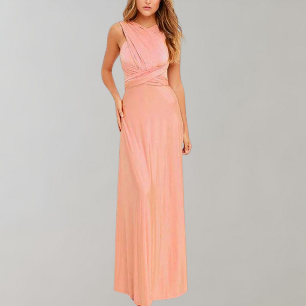 Elegante roze avondjurk met asymmetrisch ontwerp, mouwloos en vloerlengte. Perfect voor galafeesten en bruiloften. Luxe damesmode.