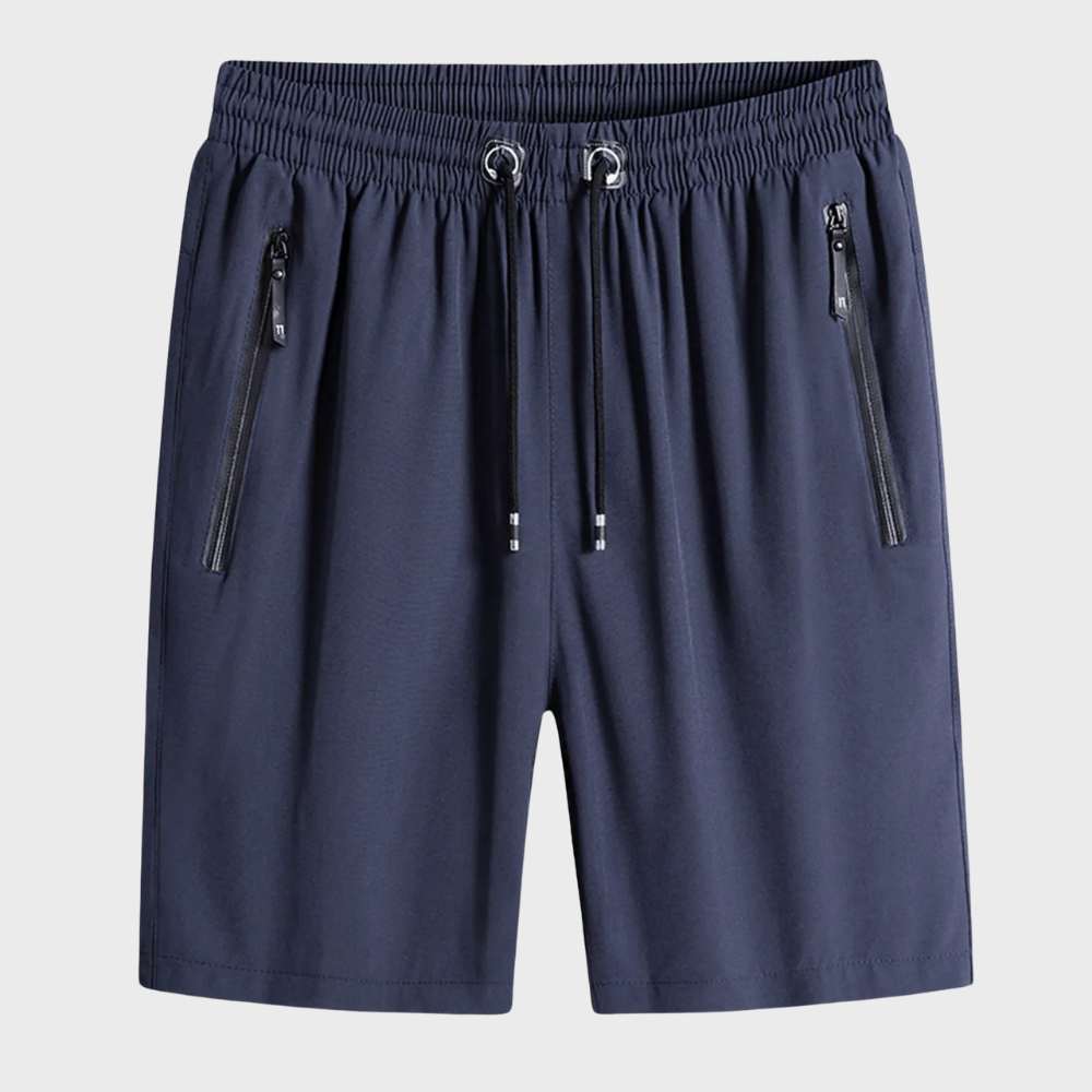 Donkerblauwe sportshorts met elastische tailleband en trekkoord, voorzien van ritszakken. Ideaal voor heren, casual en sportieve activiteiten.
