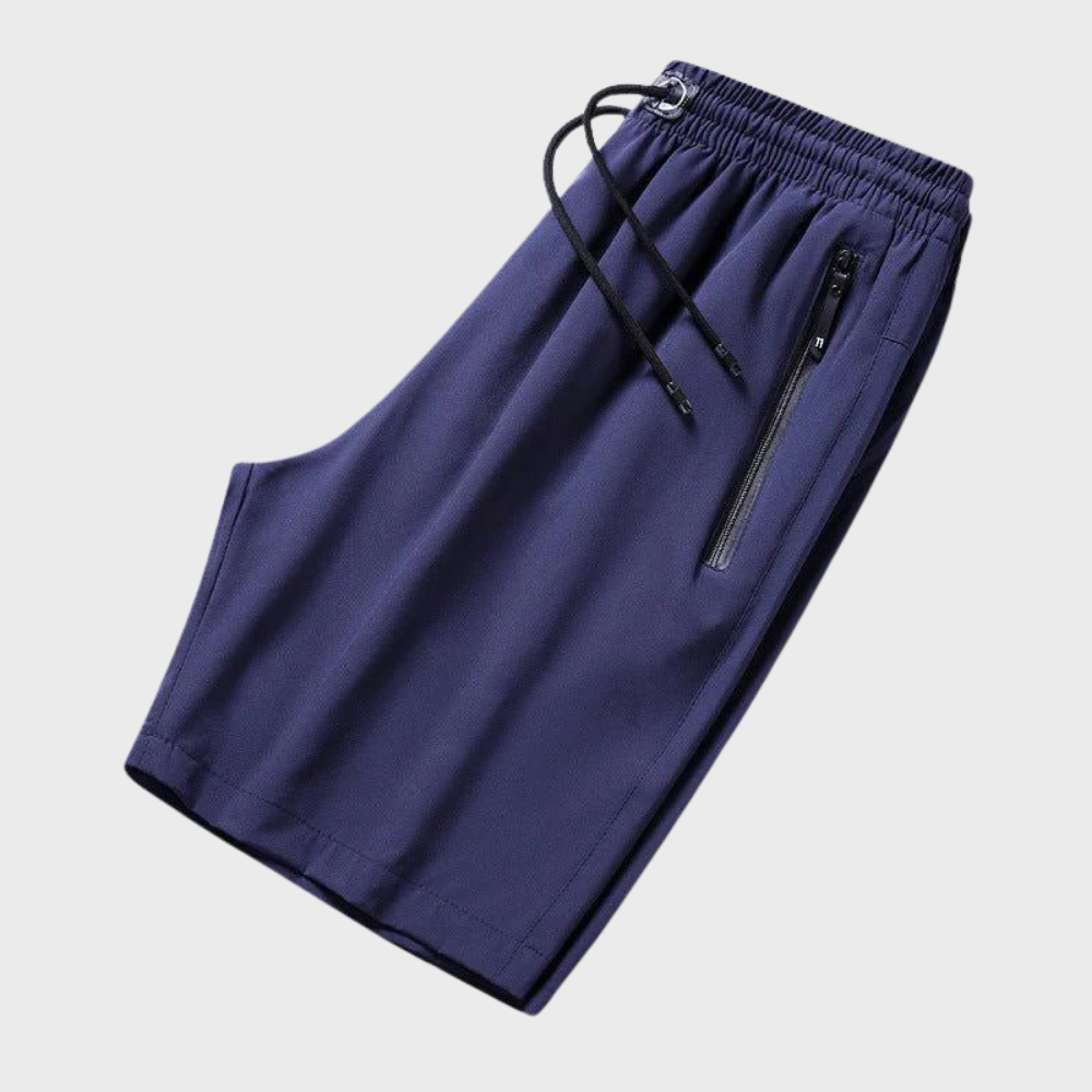 Blauwe sportshorts met elastische tailleband, trekkoord en ritszakken. Ideaal voor heren, casual en sportieve activiteiten. Comfortabele pasvorm.