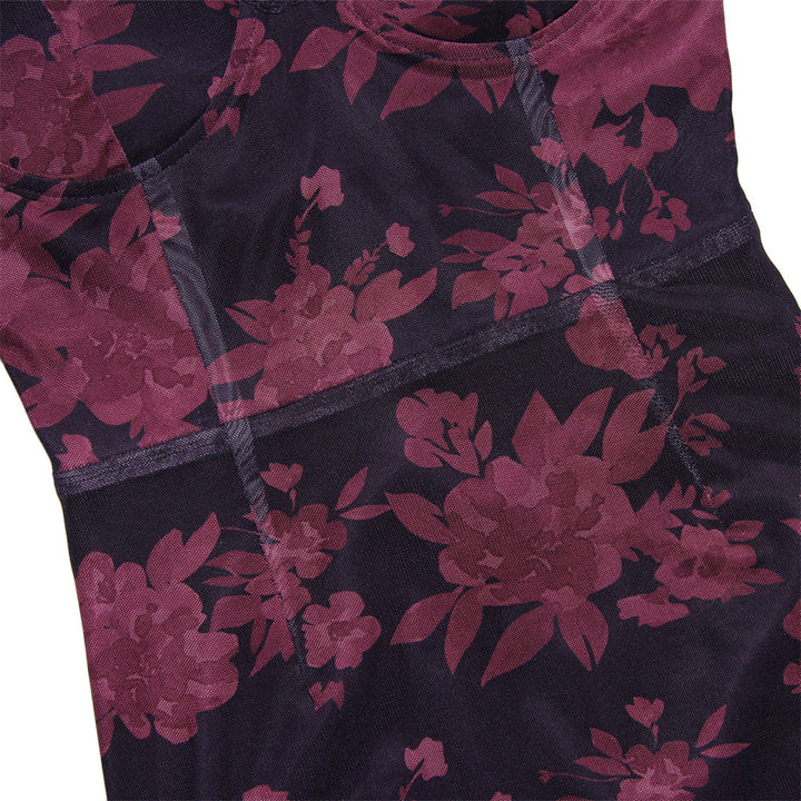 Donkerblauwe sportlegging met roze bloemenprint, naadloze afwerking en ademende stof. Perfect voor yoga en fitness. Comfortabele pasvorm.