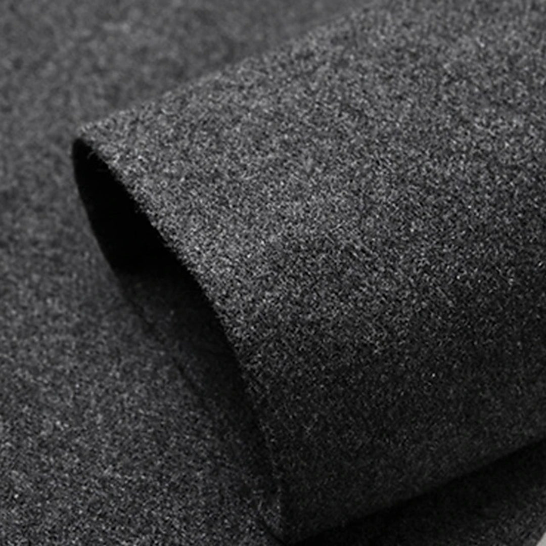 Donkergrijze wollen stof close-up, zachte textuur, geschikt voor kleding en interieur, hoogwaardige kwaliteit, duurzaam en stijlvol materiaal.