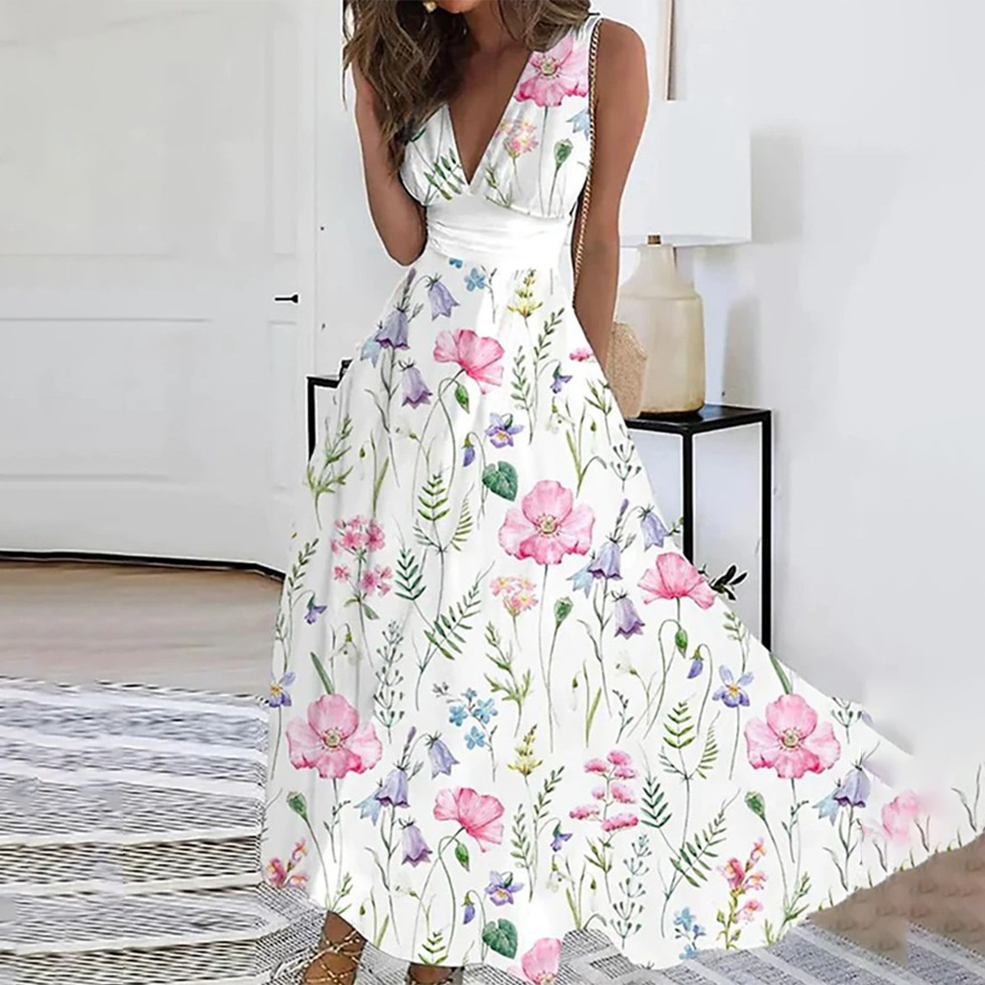 Elegante bloemenjurk met roze en paarse bloemenprint, mouwloos ontwerp, perfecte zomerjurk voor dames, ideaal voor bruiloften en tuinfeesten.