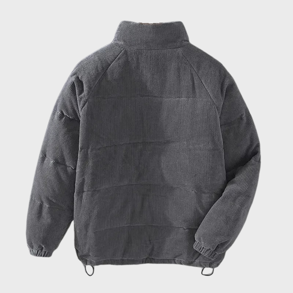 Grijze heren pufferjack, corduroy stof, lange mouwen, hoge kraag, casual winterjas, warme gewatteerde jas, modieuze herenkleding.