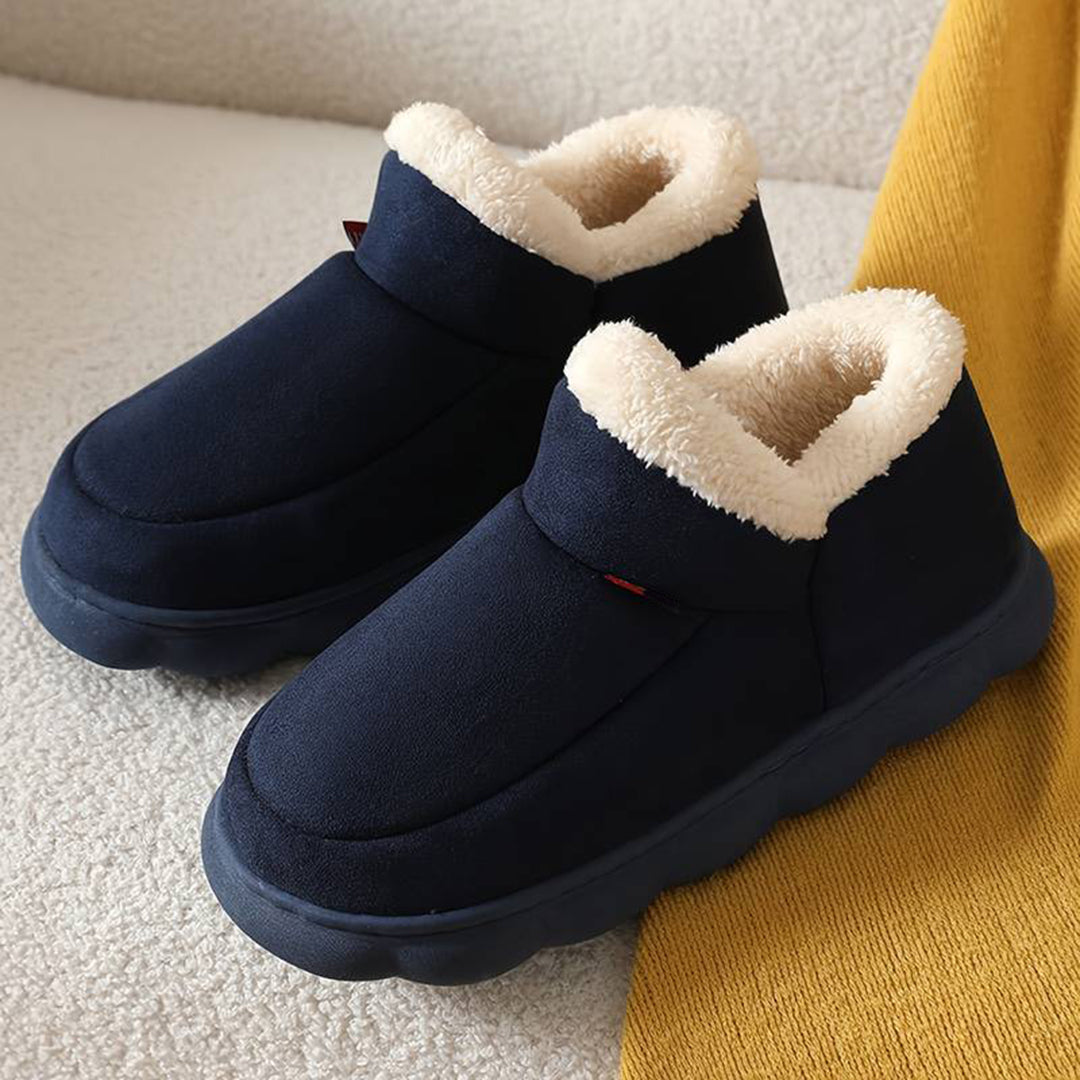 Donkerblauwe pantoffels met warme voering, antislipzool en comfortabel ontwerp. Perfect voor winter, heren en dames. Ideaal voor thuisgebruik.
