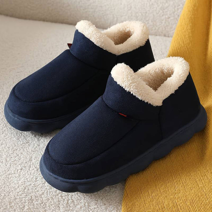 Donkerblauwe pantoffels met warme voering, antislipzool en comfortabel ontwerp. Perfect voor winter, heren en dames. Ideaal voor thuisgebruik.