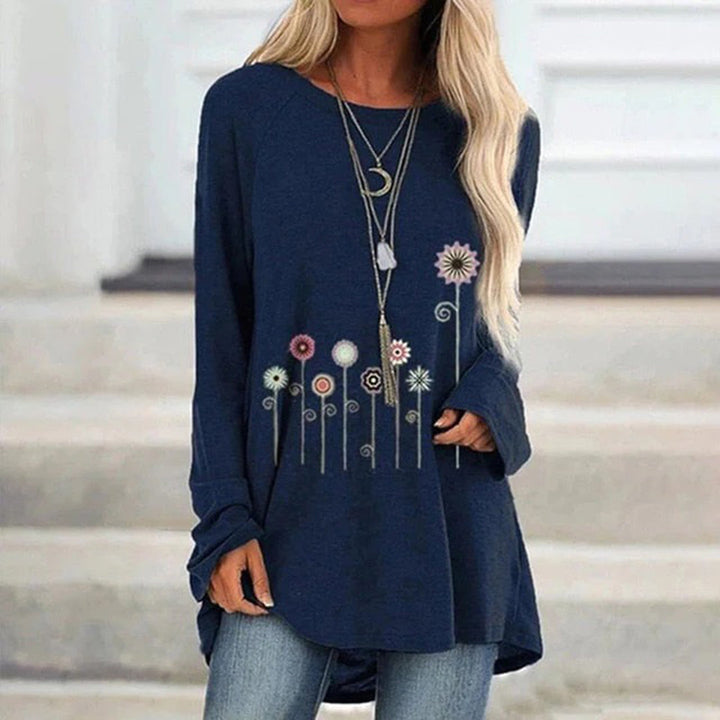Donkerblauwe damestrui met lange mouwen, bloemenprint en sierkettingen. Casual mode, comfortabele pasvorm, trendy herfstkleding.