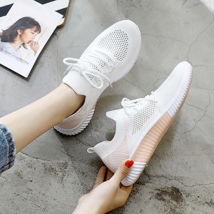 Witte sportschoenen met roze zool, ademend mesh, casual stijl, perfect voor dames, comfortabele pasvorm, trendy design, ideaal voor dagelijks gebruik.