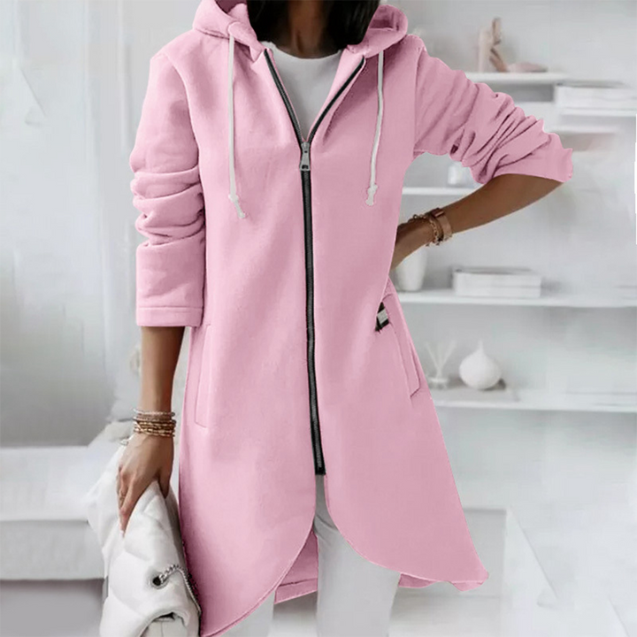 Roze dameshoodie met rits, lange mouwen en capuchon. Modieuze casual outfit, ideaal voor herfst en winter. Comfortabele en stijlvolle kleding.