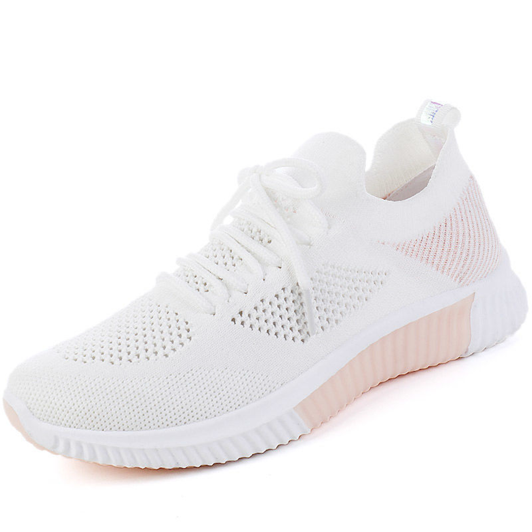 Witte dames sneaker met roze accenten, ademend mesh, lichtgewicht ontwerp, ideaal voor sport en casual gebruik. Comfortabele en modieuze sportschoen.