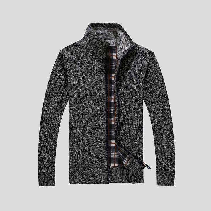 Grijze gebreide herenvest met rits, geruite voering en opstaande kraag. Stijlvolle en warme winterkleding voor casual en formele gelegenheden.