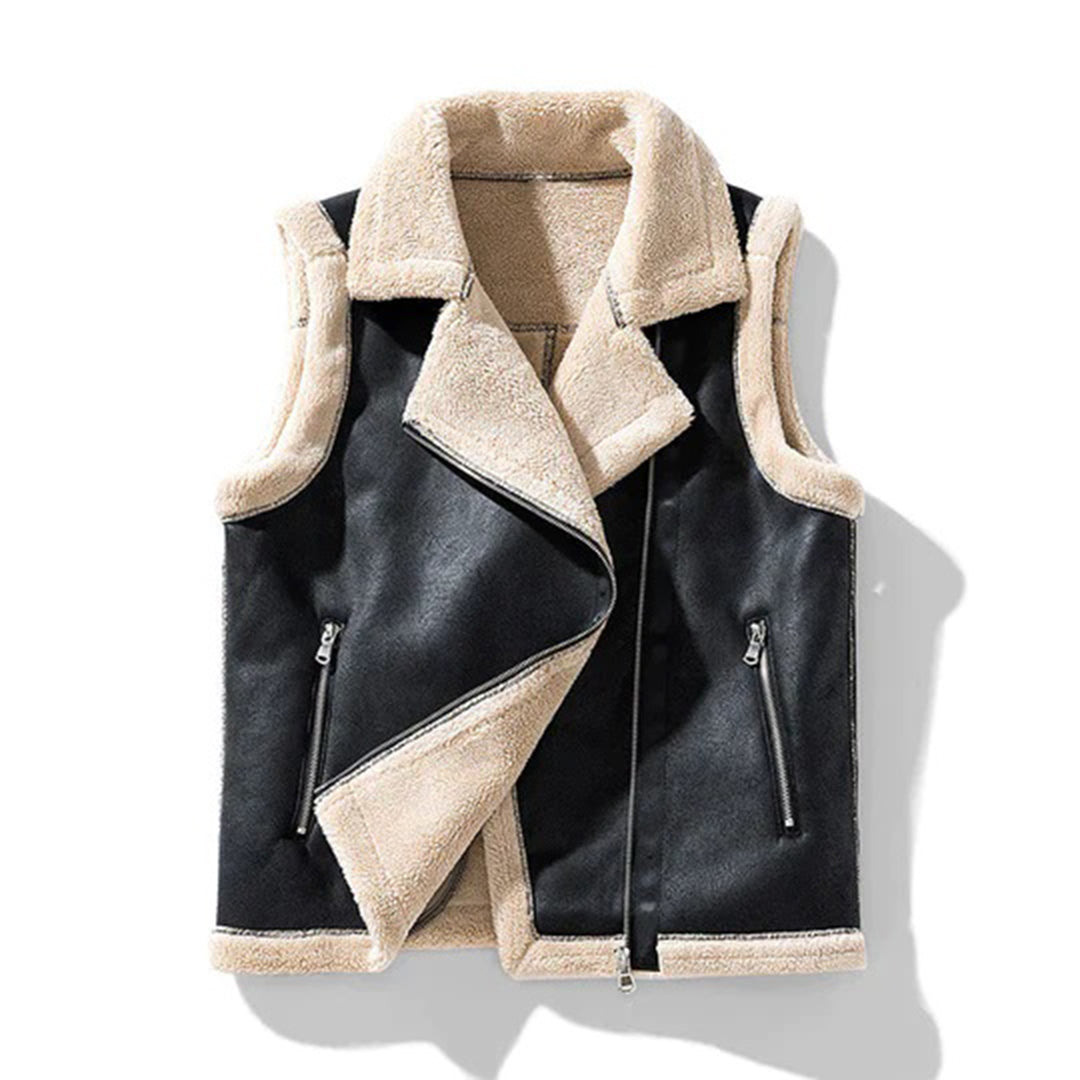 Zwarte fluwelen mouwloze jas met beige voering, asymmetrische ritssluiting en twee ritszakken. Stijlvolle wintermode voor dames.
